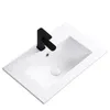 A white ceramic sink with a black faucet, shown from a top-down diagonal angle against a white background. Podgląd zdjęcia produktu