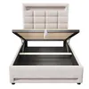 A beige upholstered bed frame with the mattress support mechanism open, revealing storage space underneath. Produktbild-Vorschau