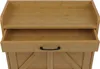 Close-up view of a wooden drawer with a black handle, part of a piece of furniture. Podgląd zdjęcia produktu