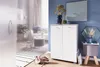 A modern living room or hallway with a white shoe cabinet, decorative items, and a rug. Náhled obrázku produktu