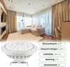 A living room with a sofa, curtains, and a fireplace, with a spotlight and product information overlay. Produktbild-Vorschau