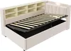 A beige upholstered bed frame with an open storage compartment and a slatted bed base, shown from a diagonal angle. Produktbild-Vorschau