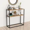 A console table with decorative items on it, placed against a white wall. Náhled obrázku produktu