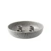 A speckled gray ceramic candle holder with four candle holders arranged in a circle. Produktbild-Vorschau