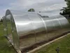 A greenhouse in an outdoor setting. Produktbild-Vorschau