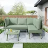 An outdoor patio scene with a green sectional sofa and coffee table. Anteprima dell’immagine prodotto