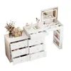 A white vanity table with drawers and a lighted mirror, displaying various cosmetic products and accessories. Anteprima dell’immagine prodotto