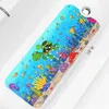 A colorful bath mat with an underwater theme, featuring cartoon sea creatures like turtles, fish, and jellyfish, placed inside a white bathtub. Produktbild-Vorschau