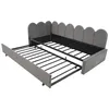 A gray upholstered daybed with a pull-out trundle bed extended. Náhľad obrázku produktu