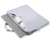 A light gray laptop sleeve with a silver laptop partially inserted, and accessories inside the sleeve. Náhľad obrázku produktu