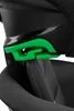 A close-up view of a green buckle mechanism on a black car seat. Náhled obrázku produktu