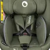 A close-up view of a green car seat's harness and headrest. Produktbild-Vorschau