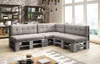 A sectional sofa made from pallets in a living room setting. Produktbild-Vorschau