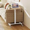 A laptop table is placed next to a sofa in a living room. Produktbild-Vorschau