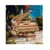 A miniature wooden grand piano with a bench, set in a whimsical, mossy, and mushroom-filled environment. Podgląd zdjęcia produktu