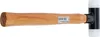 A hammer with a wooden handle and a black and white head is shown against a white background. Produktbild-Vorschau