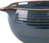 A close-up shot of the rim and spout of a blue ceramic bowl. Podgląd zdjęcia produktu
