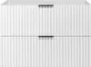 A front view of a white, two-drawer vanity cabinet with vertical ribbed detailing and black handles. Produktbild-Vorschau
