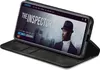 A smartphone in a black flip case is propped open, displaying a movie streaming interface on its screen. Produktbild-Vorschau