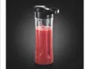 A clear studio shot of a portable blender bottle filled with a red smoothie, against a dark gradient background. Produktbild-Vorschau