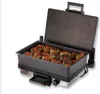 A contact grill filled with stuffed peppers, with the lid open. Produktbild-Vorschau
