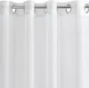A close-up view of a white curtain with grommets. Produktbild-Vorschau