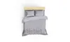 A top-down view of a bed with bedding. Podgląd zdjęcia produktu