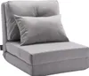 A gray convertible floor sofa with a pillow, shown in its upright chair configuration. Voir les images du produit
