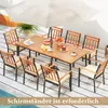 An outdoor dining set with a table and chairs on a patio, under an umbrella. Produktbild-Vorschau
