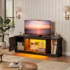A modern living room with a TV stand featuring a television and various decorative items. Anteprima dell’immagine prodotto