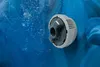 A close-up of a jet nozzle in a blue hot tub. Produktbild-Vorschau