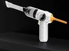 A white and orange handheld vacuum cleaner with a brush attachment and a nozzle attachment, set against a black background. Produktbild-Vorschau