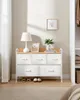 A chest of drawers with clothing items in a closet. Náhled obrázku produktu