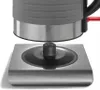 A close-up view of the base of a black and silver electric kettle, showing the connection point to its power base. Podgląd zdjęcia produktu
