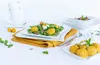 A table setting with a salad and food balls, along with cups and flowers. Produktbild-Vorschau