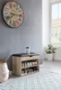 A hallway scene with a shoe bench, a clock on the wall, and a plant by the window. Produktbild-Vorschau