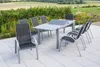 An outdoor patio setting with a dining set and a garden view. Náhled obrázku produktu