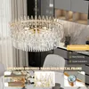 A luxurious crystal chandelier is displayed in a modern dining room setting, with text overlays highlighting product features. Produktbild-Vorschau