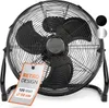 A black floor fan is shown against a white background. A tag is attached to the fan with product information. Náhľad obrázku produktu