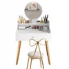 A white vanity table with a round mirror and a gold chair in front of it, set against a white background. Náhľad obrázku produktu