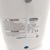 A close-up of a label on a white appliance. Voir les images du produit