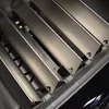 Close-up view of stainless steel burner covers for a grill. Podgląd zdjęcia produktu