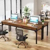 An office setting with a long wooden desk and chairs. Podgląd zdjęcia produktu