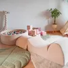 A child's play area with soft play equipment, a ball pit, and toys. Produktbild-Vorschau