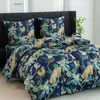 A bed with a duvet cover and pillows featuring a jungle print with leopards. Náhľad obrázku produktu