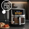 A kitchen counter with an air fryer and some bread and tomatoes. Produktbild-Vorschau