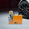 A portable air compressor is shown next to a car tire. Produktbild-Vorschau