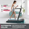 A woman is using a treadmill in a modern living room setting. Produktbild-Vorschau