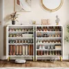 A white shoe cabinet with multiple shelves filled with shoes and boots, placed in an entryway or living space. Produktbild-Vorschau