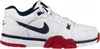 A side view of a white Nike Cross Trainer Low sports shoe with navy blue and red accents. Náhled obrázku produktu